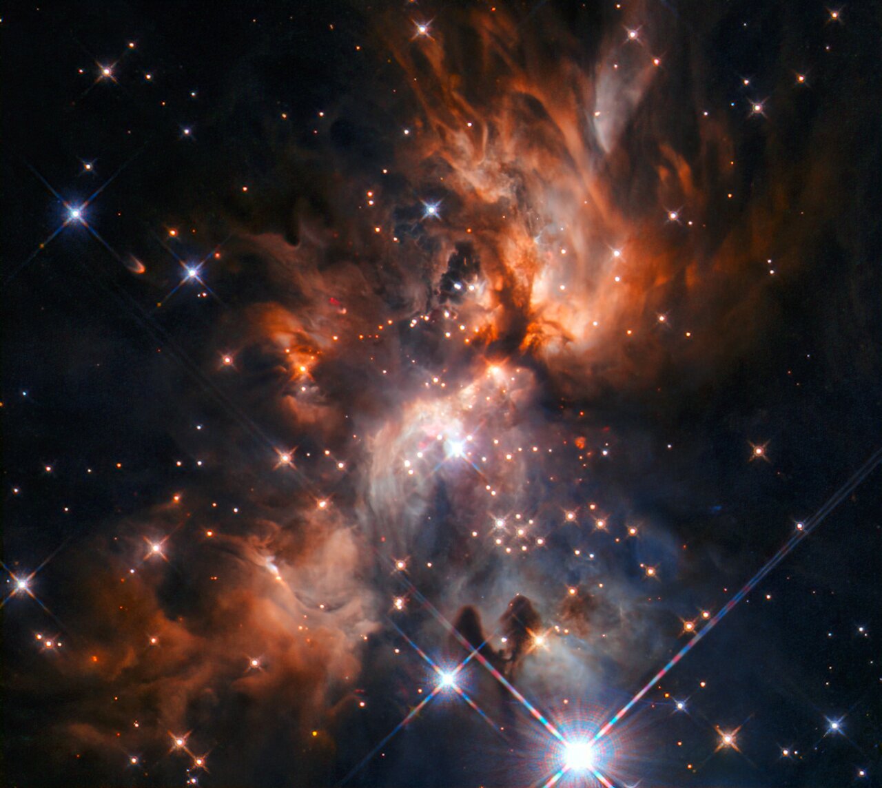 Ділянка зореутворення AFGL 5180. Credit: ESA / Hubble & NASA, J. C. Tan (Chalmers University & University of Virginia), R. Fedriani (Chalmers University)